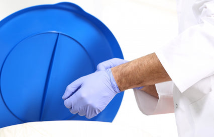 person removing gloves