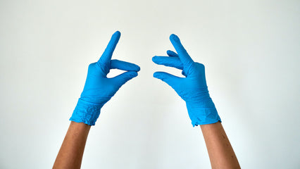 gloved hands reaching into the air