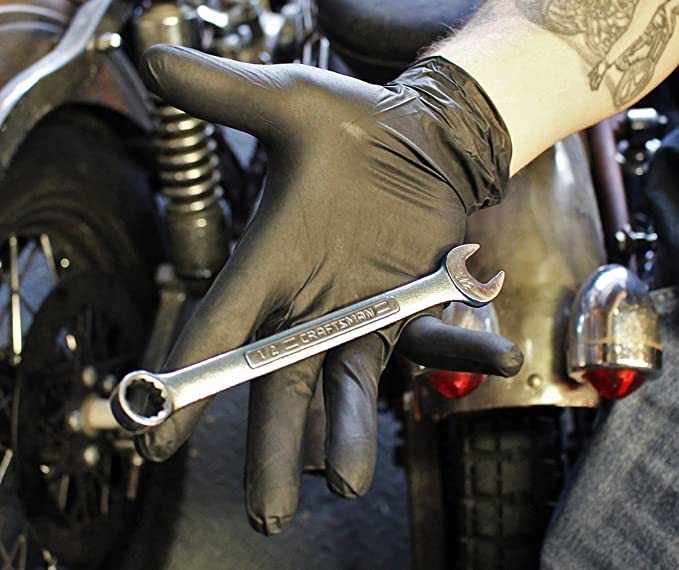 Black Nitrile Gloves and Automotive Tool on hand