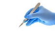 Wearing Blue Glove while using a medical tool
