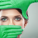 A woman wearing green gloves